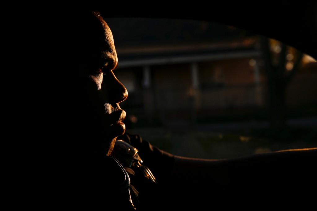 San Bernardino Police Department Officer Darren Sims drives his patrol car at sunrise on the graveyard shift.