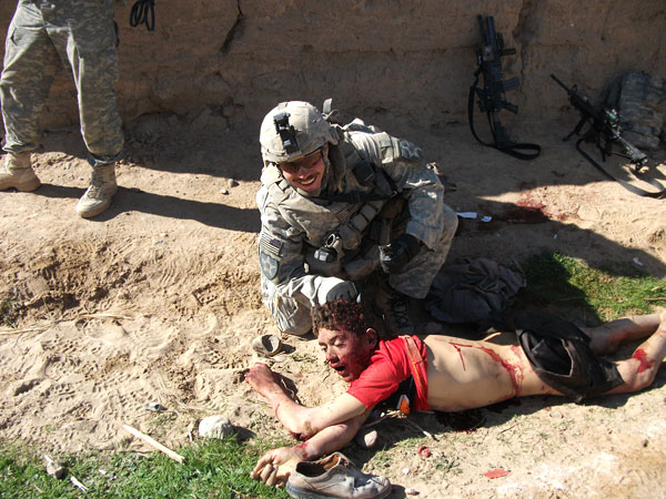 kill-team-jeremy_morlock_pulling_dead_afghan_boy_by_his_hair_in_2010
